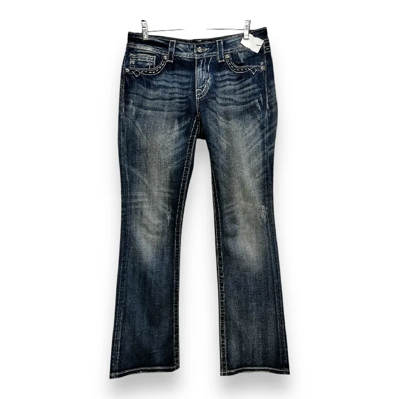 Dark wash jeans with whiskering and fading at the thighsJeans Flared By Miss Me In Blue Denim, Size: 8