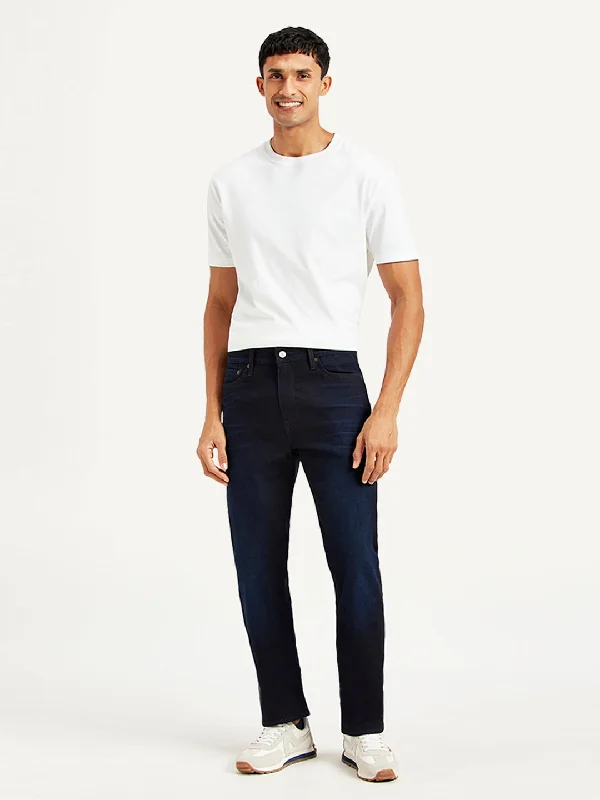 Light wash jeans with rips and tears for a casual vibeMen's 513 Slim Straight Fit Navy Jeans